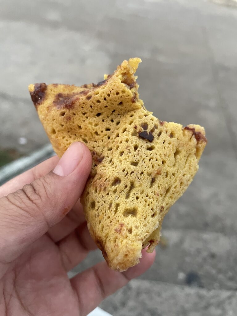A slice of tarambulan with a bite
